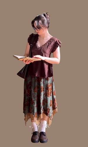 Top and flowing skirt while reading